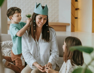 Woman and children engaged in pediatric speech therapy process