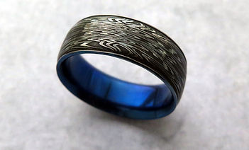 Titanium-sleeved-damascus-ring.jpg