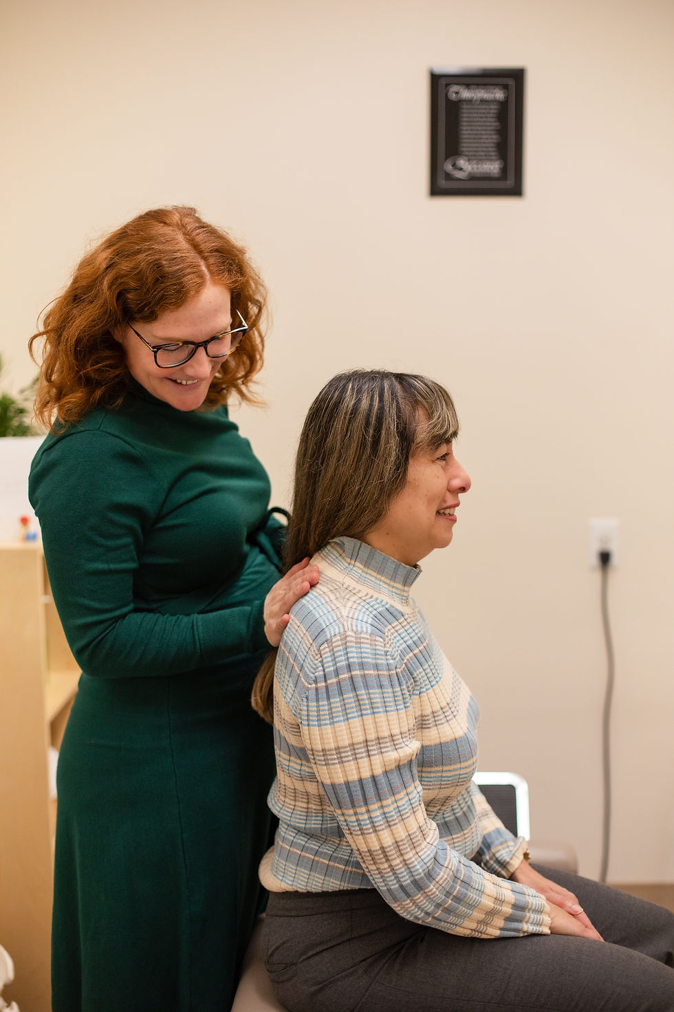 Dr. Bronwyn Hunt performing gentle adjustments to relieve neck stiffness and improve mobility in Richmond, BC.