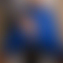 Dr. Eugene applying gentle adjustments to a patient lying down.