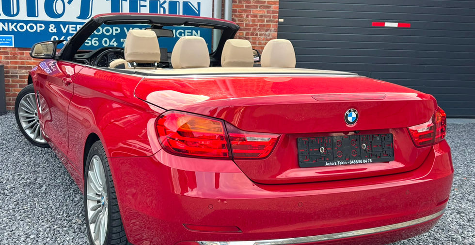 BMW 420i Luxury Line Cabrio Hardtop 184 pk 2015 achteraanzicht met elektrische hardtop en luxe uitstraling