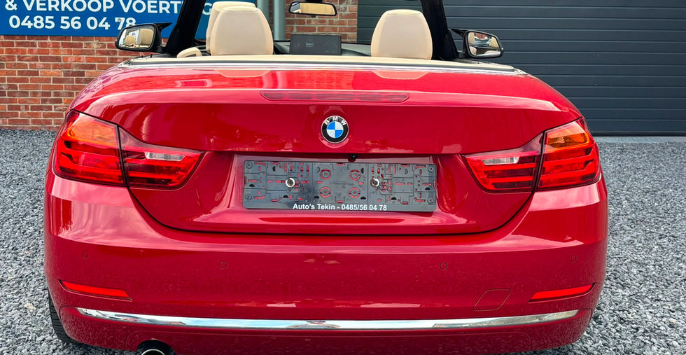 BMW 420i Luxury Line Cabrio Hardtop 184 pk 2015 achteraanzicht met elektrische hardtop en luxe uitstraling