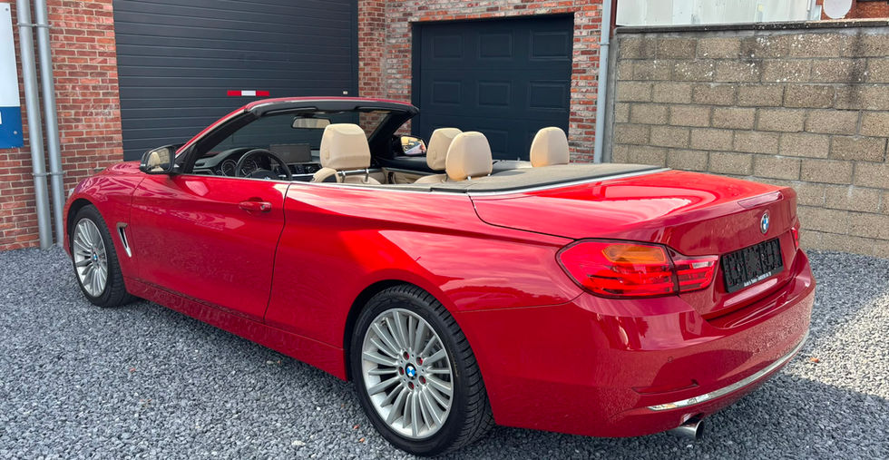 BMW 420i Luxury Line Cabrio Hardtop 184 pk 2015 achteraanzicht met elektrische hardtop en luxe uitstraling