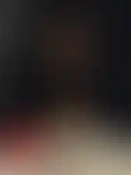 Avant-garde dress by REPULO'S with wings folded into a dramatic tail structure.