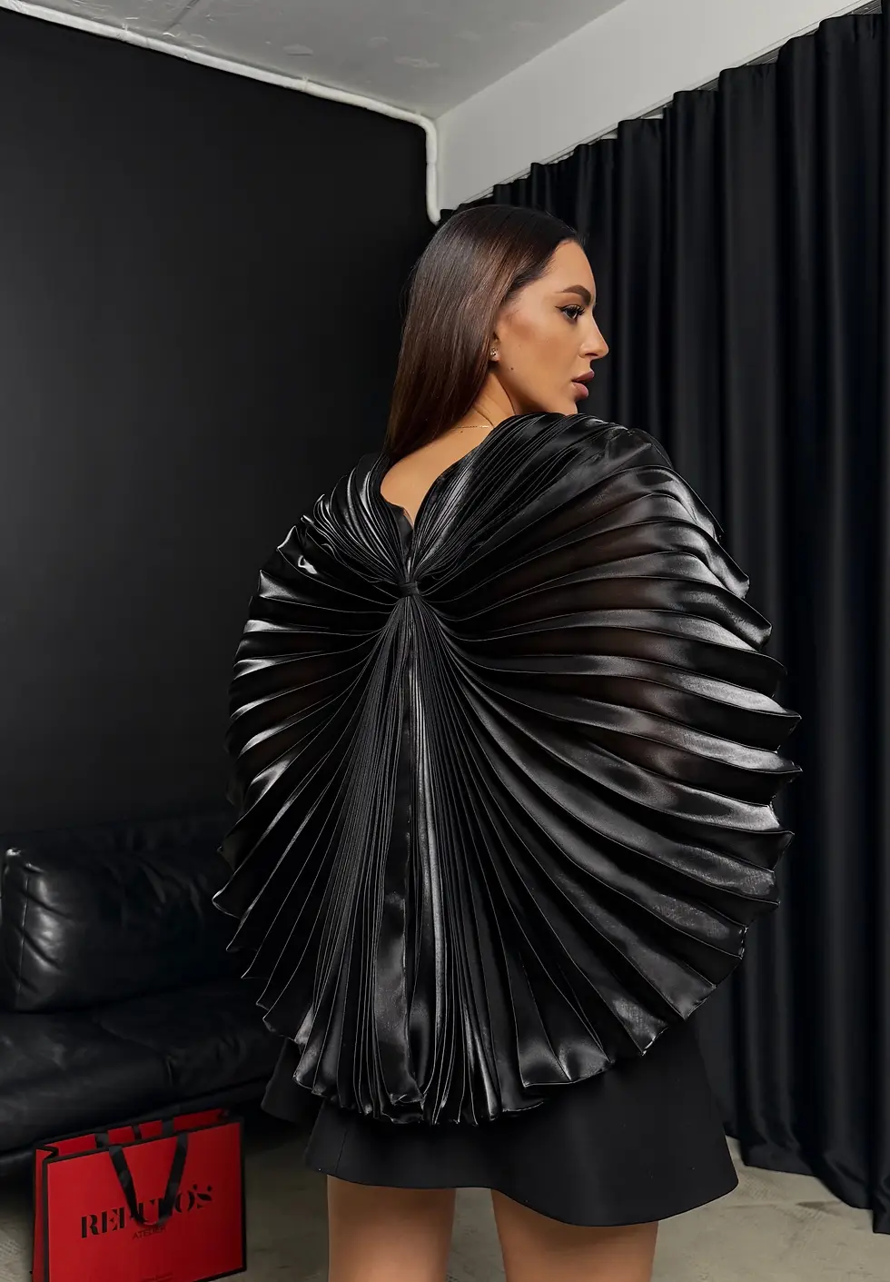 Avant-garde dress by REPULO'S with butterfly-like structural wings spread out.