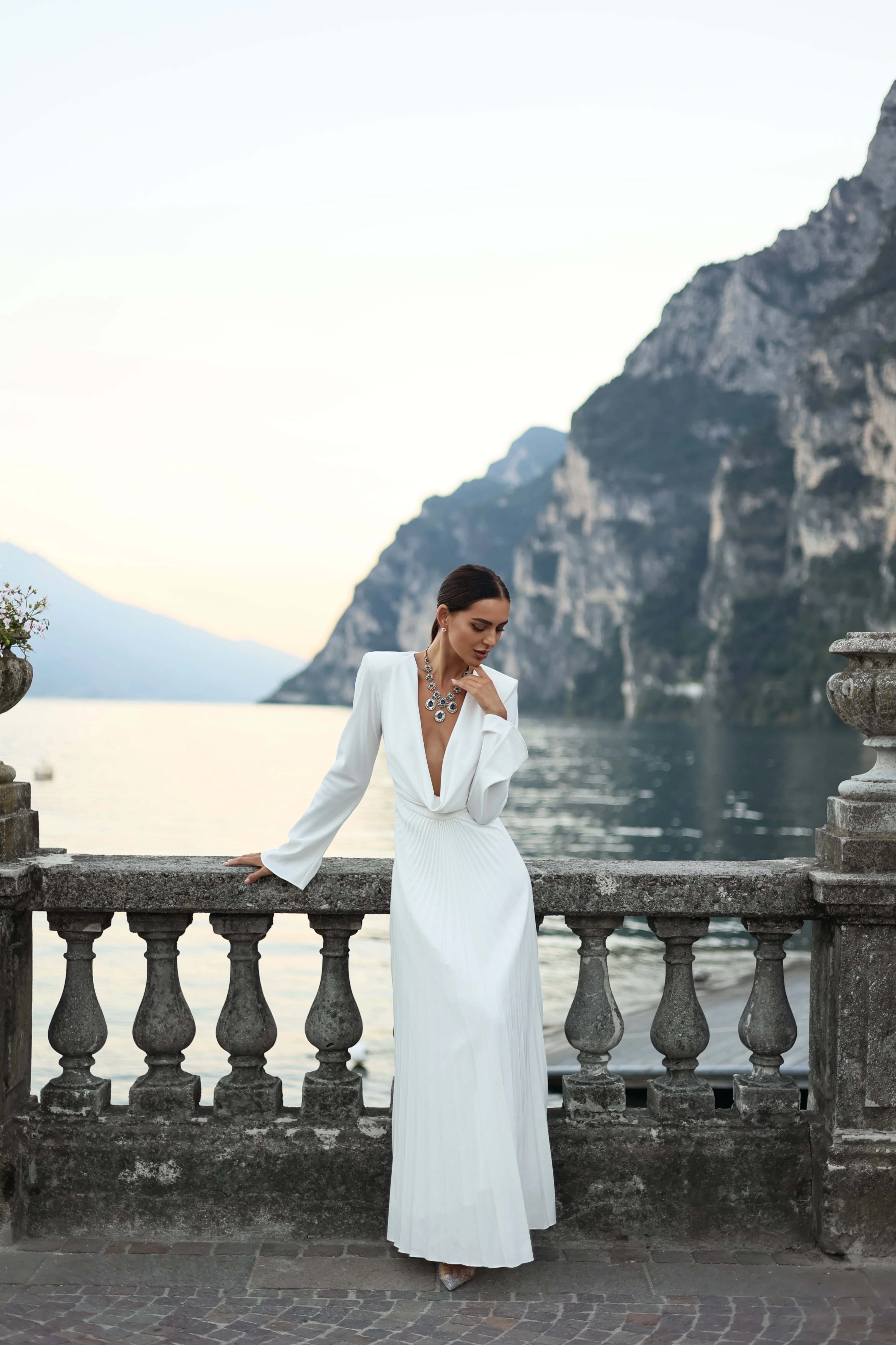 Evening dress with a deep neckline in white color of the year