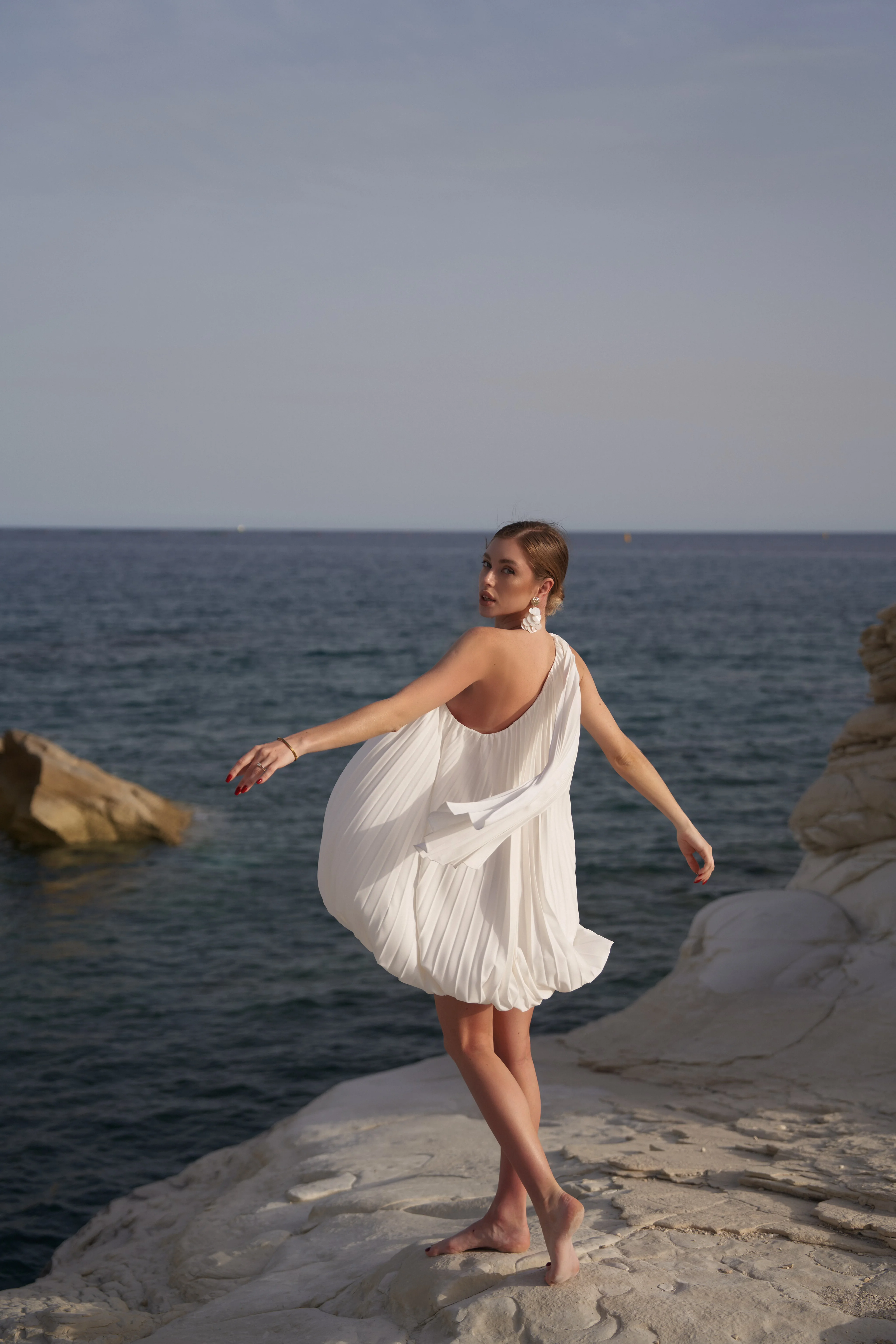 What to pack for a luxury vacation in Europe bubble hem mini dress Bon bon seaside outfit