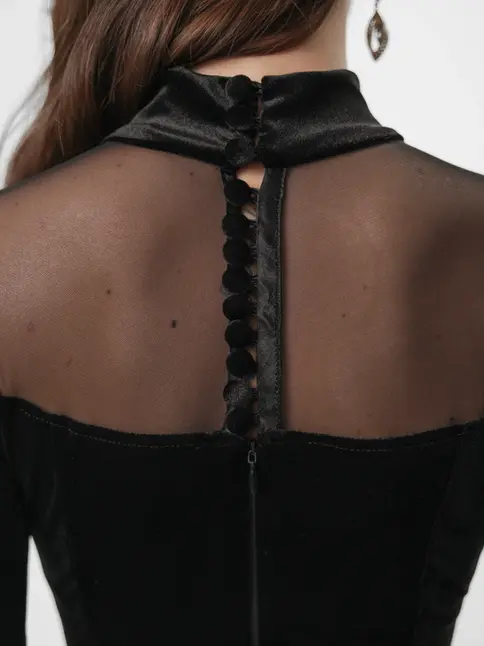 Back view close-up of gown with small buttons and hidden zipper