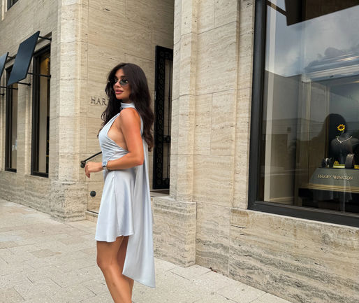 uxury vacation in Europe outfit idea satin halter neck mini dress Bree evening look