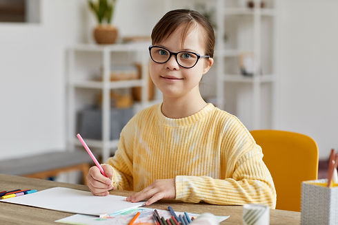 girl-with-down-syndrome-studying-at-home-2022-09-27-18-23-40-utc.jpg