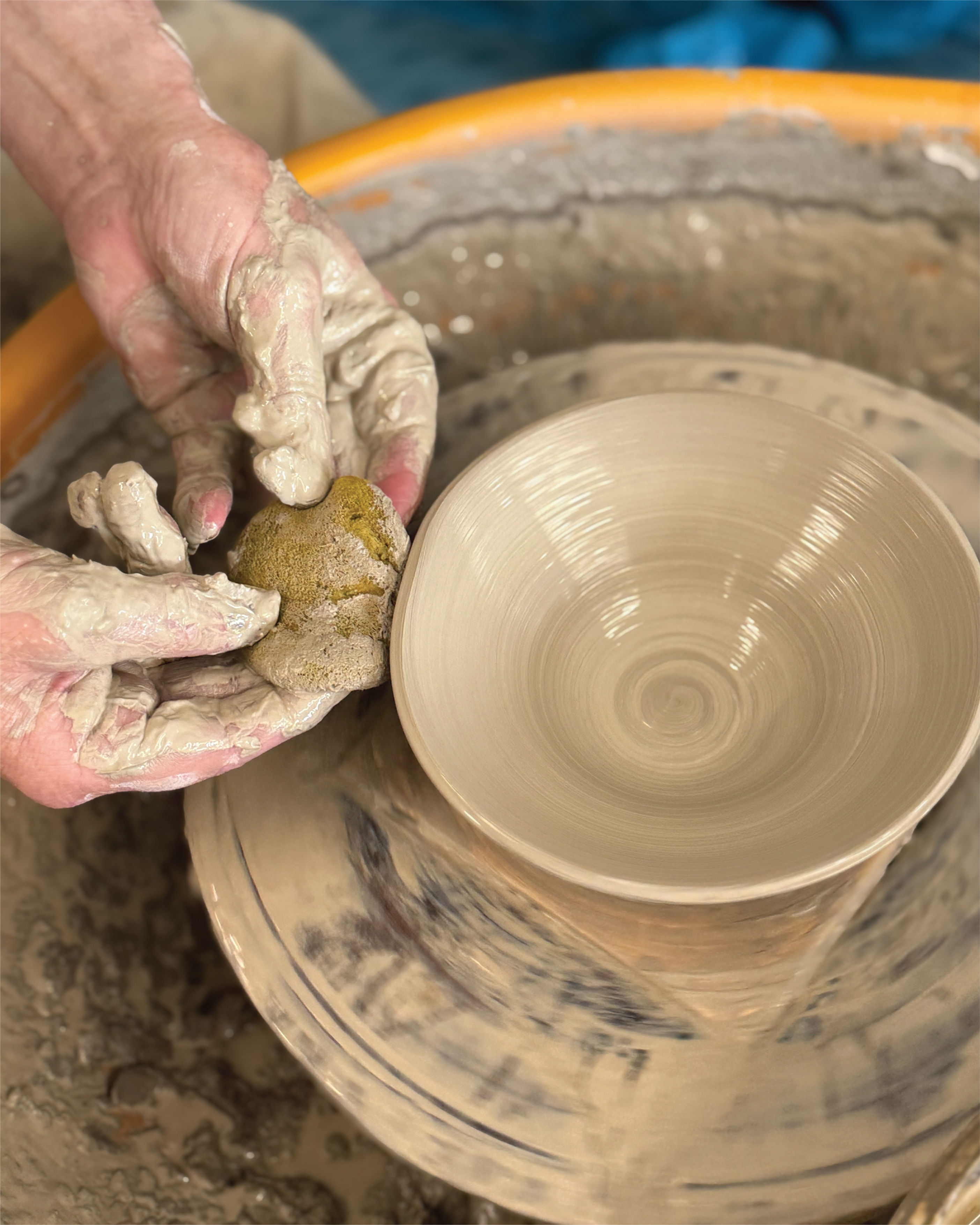 Mark crafting a vase on a pottery wheel.