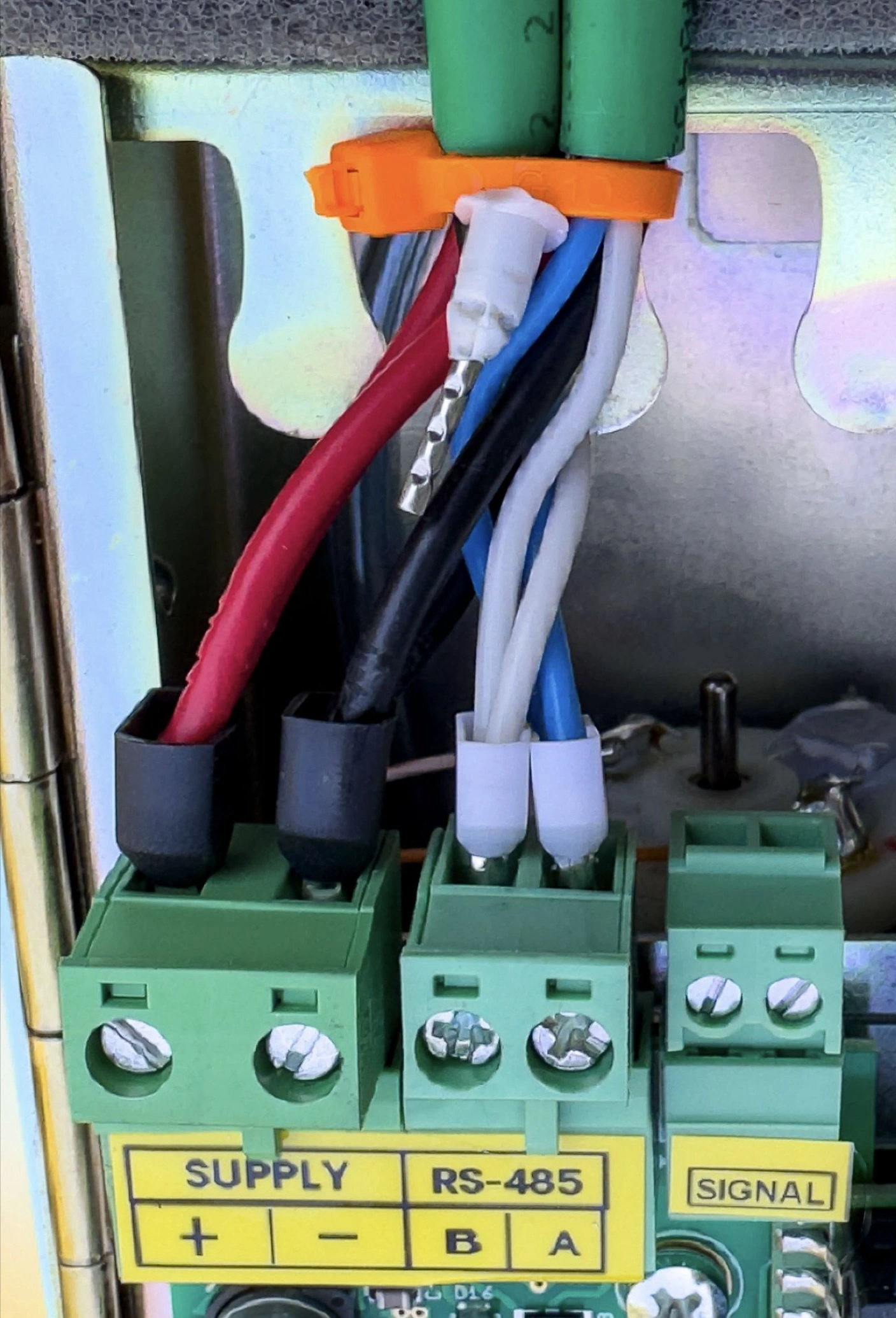 +24V DC = Red wire, -24V DC= Black wire, Modbus A wire (positive) = Blue wire, Modbus B wire (negative) = White wire