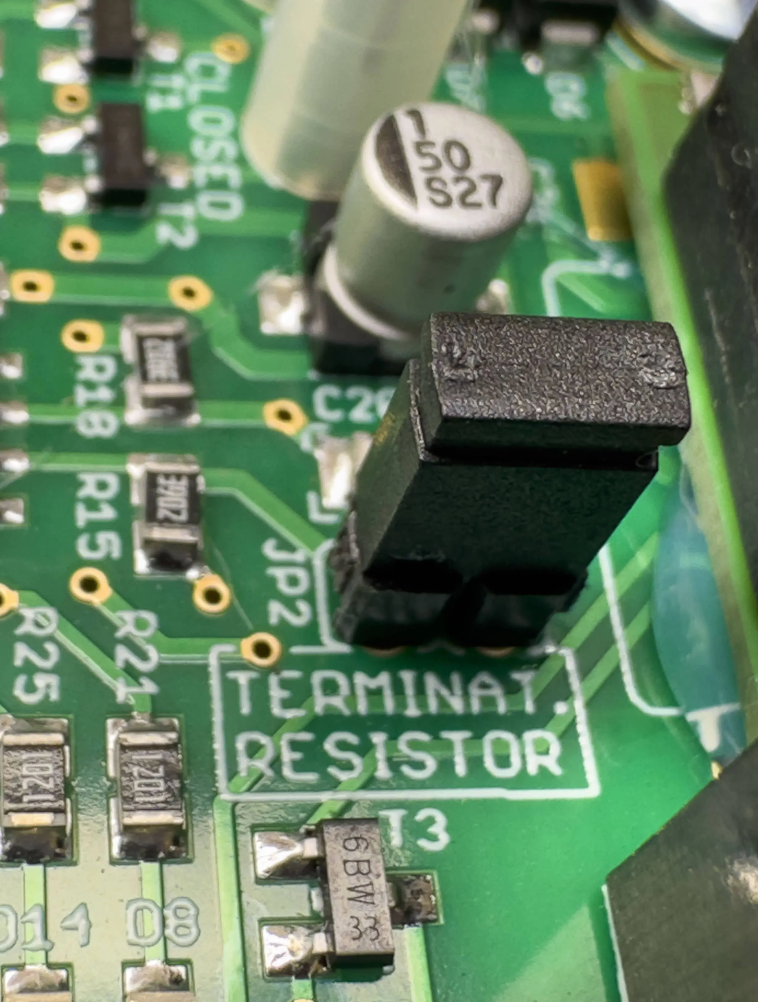 Close up of black connected terminating resistor jumper
