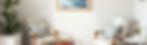 a minimalistic therapists office with soft hues and traditional furniture and nothing on t