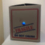 Tom Loveday, The Language of the Gods (DO NOT CRUSH), 2019, SD Video and Cardboard Box, 32