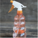 an orange clear spray bottle