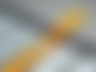 Yellow arrow breaking through a barrier among white arrows on a gray surface, symbolizing leadership and innovation.