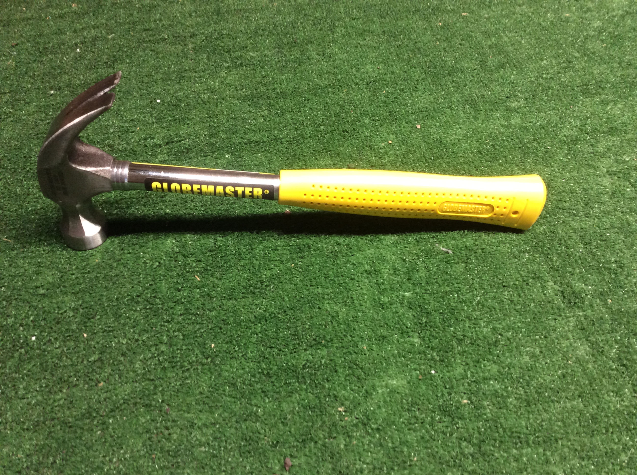 Claw hammer with yellow grip, 'GRIPMASTER' label