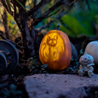 1:12 scale hand-sculpted and hand-painted miniature pumpkin light with demon cat pattern and flickering light