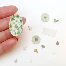 1:12 scale ceramic plates and ornaments made using the M-BOSS micro Christmas tree cutter.