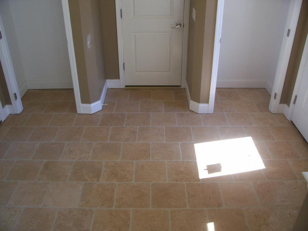 open face travertine mudroom