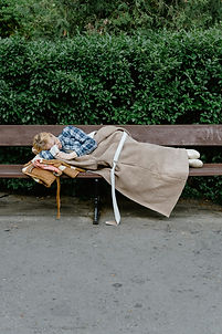 Man sleeping on bench.