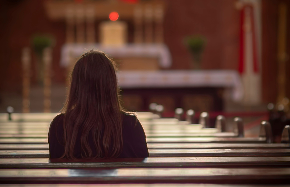 woman in church pew