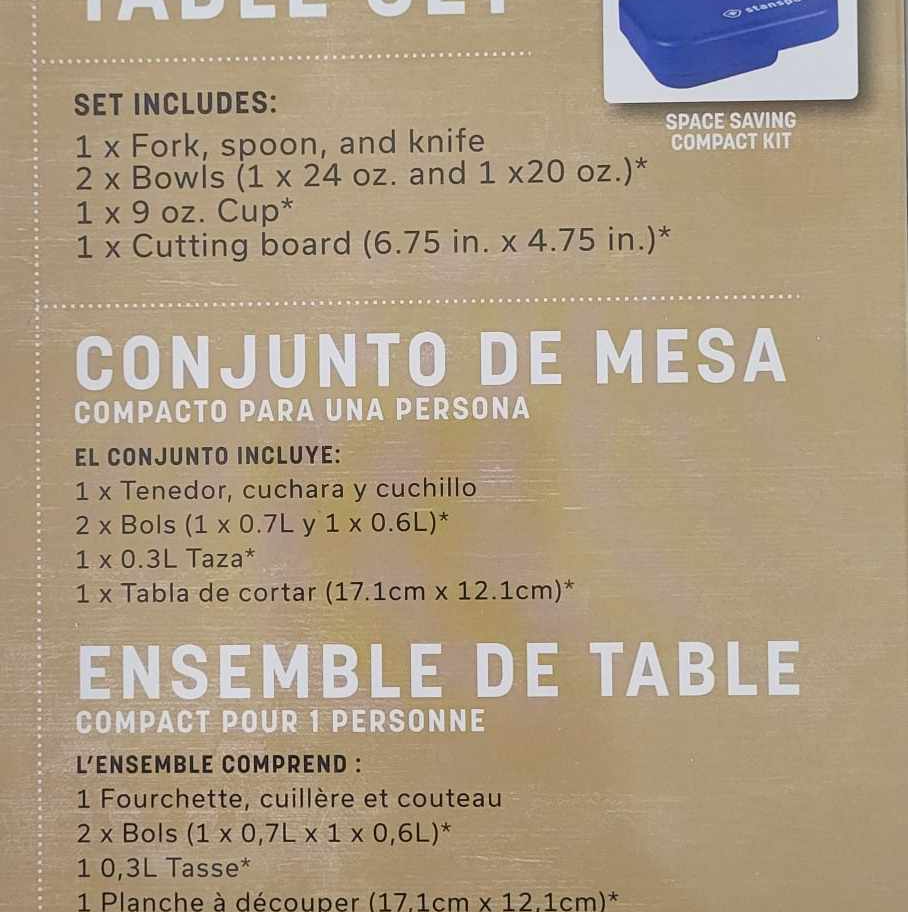 Table set contents: fork, spoon, knife, 2 bowls, cup, cutting board.