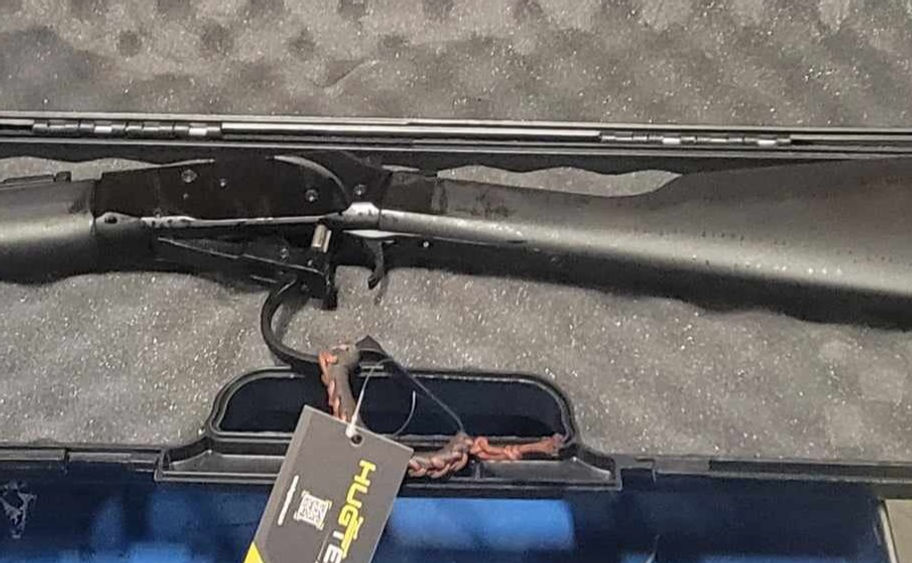 Bolt-action rifle in padded case