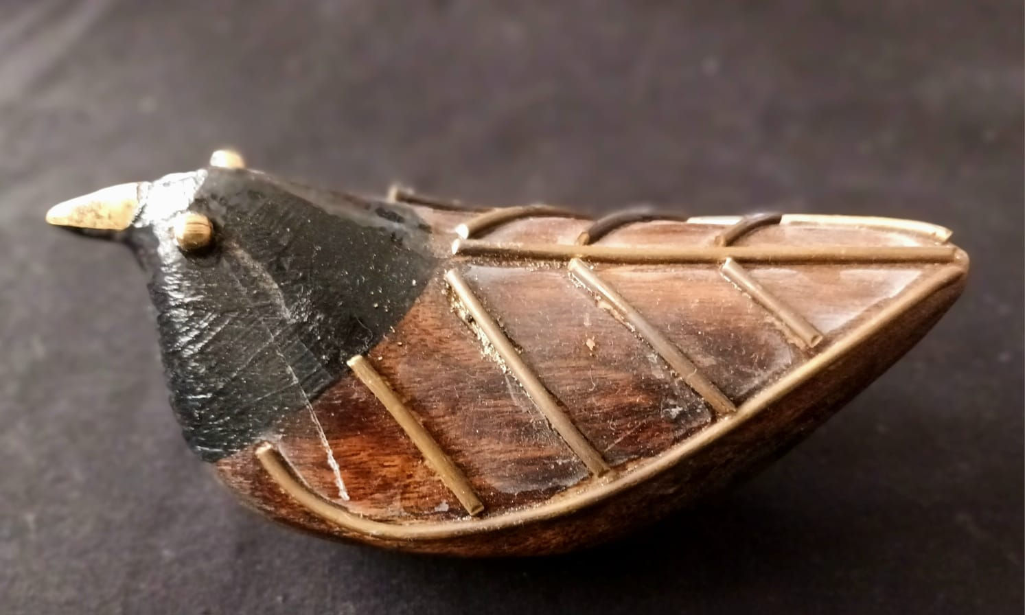 Table Decor: Wooden bird with brass embellishment