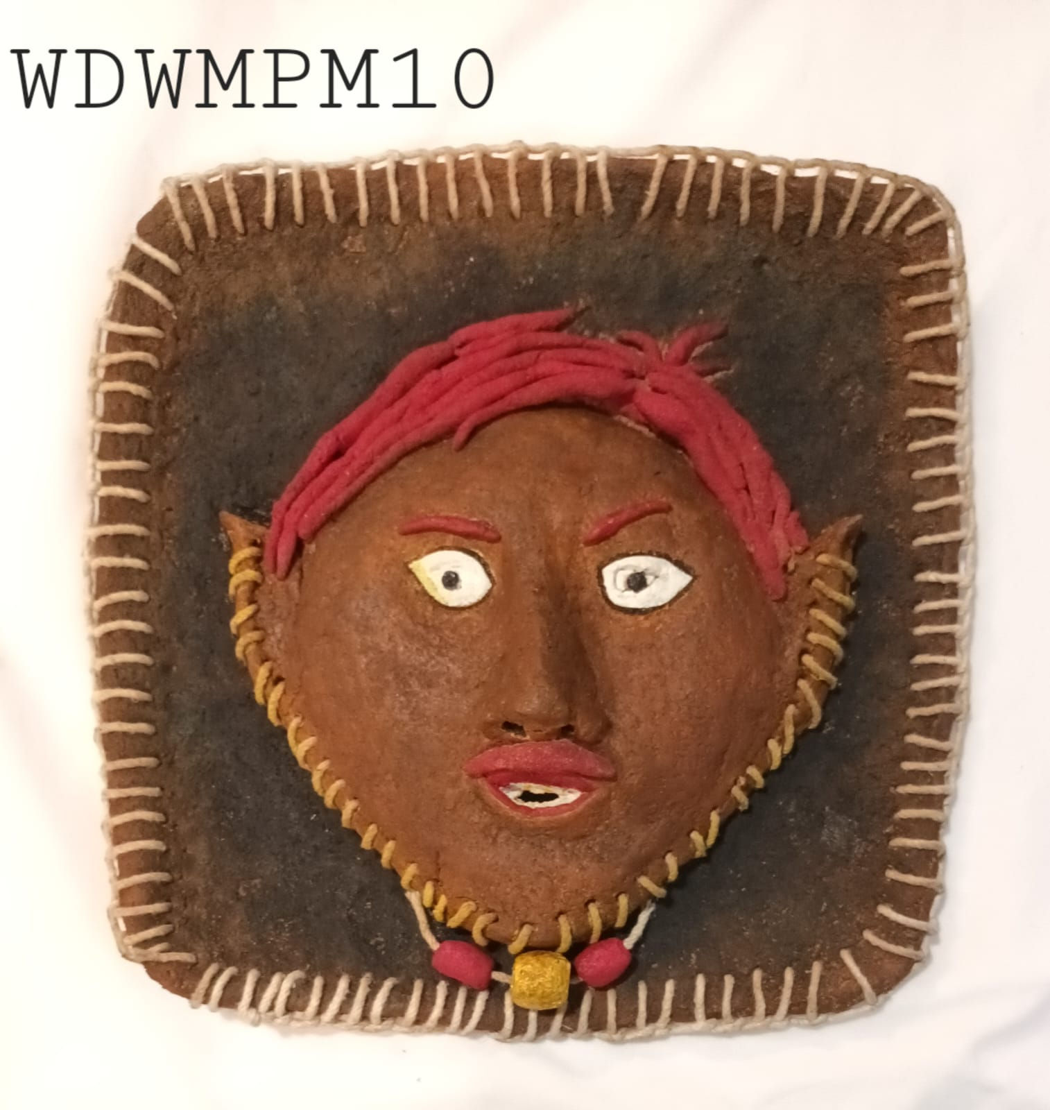 Wall Decor: Wood-mache face in rectangular frame