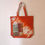Thumbnail: Bag: Orange cotton tie-dye bag with Kantha-embroidered pocket