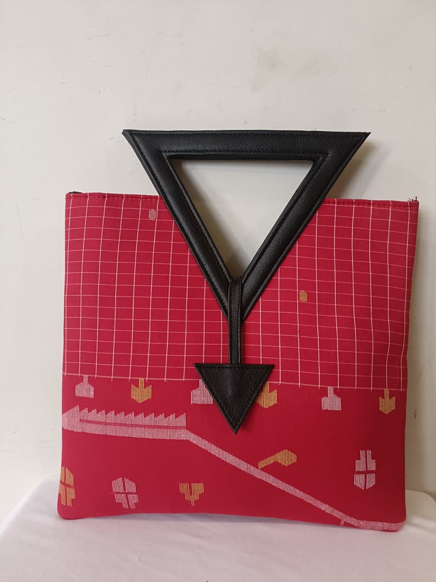 Bag: Red colored jamdani handbag with black triangular handle
