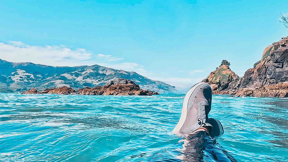 Coasteering from paddleboards at Akaroa, New Zealand