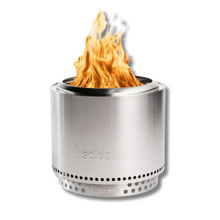 Modern stainless steel smokeless fire pit styled for cozy outdoor summer evenings and backyard gatherings.