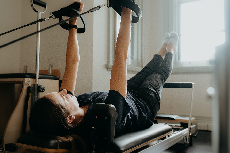 Female physiotherapist on Pilates reformer bed at Move Sports Physiotherapy in Geelong