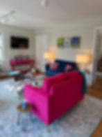 A picture of a couch and tables in a room 
