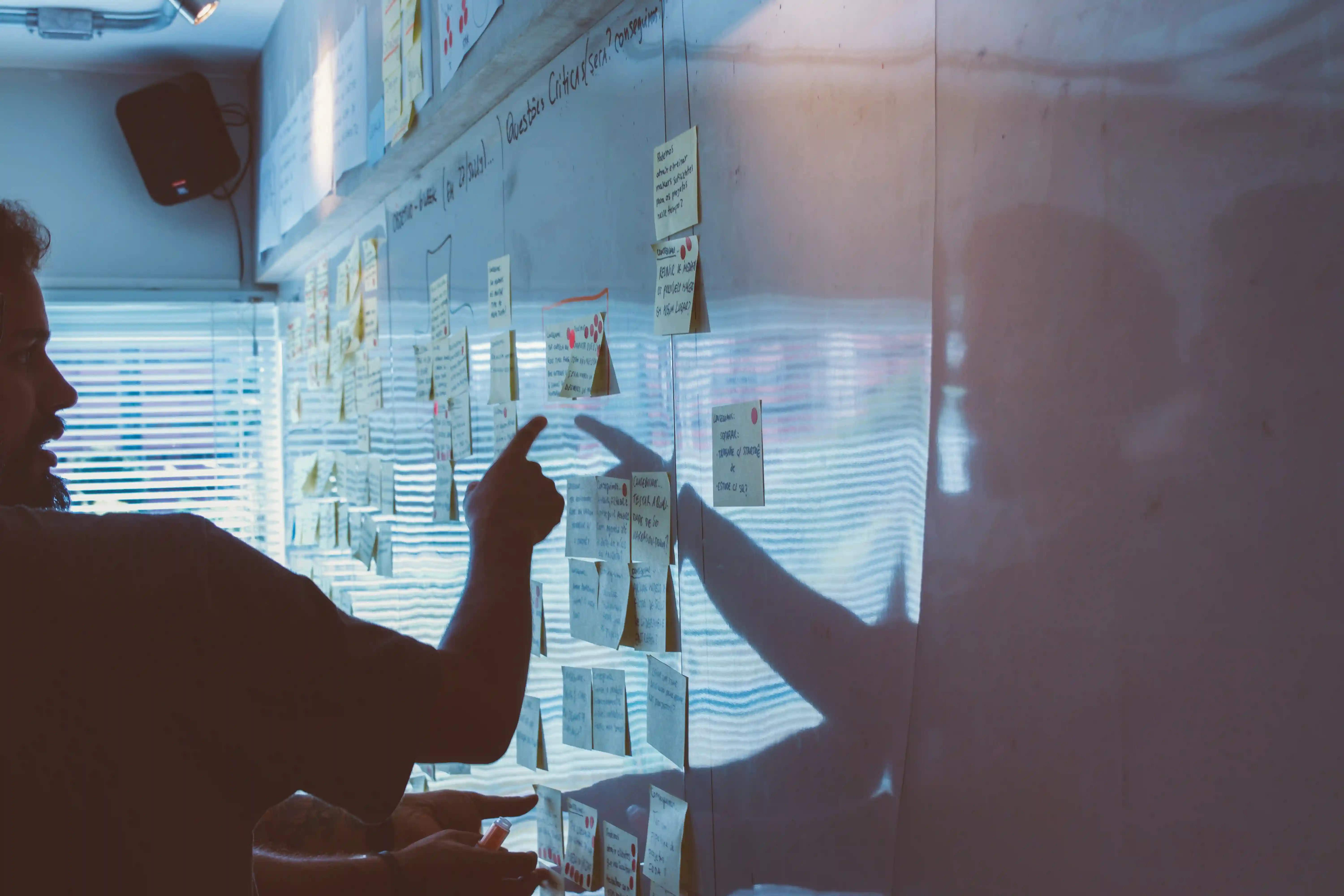 A white board displaying inbound and outbound marketing strategies with sticky notes on it.