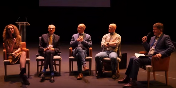 Conference discussion panel of speakers