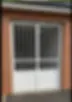 grille de porte double ouvrante blanche barreaudée pour grande ouverture