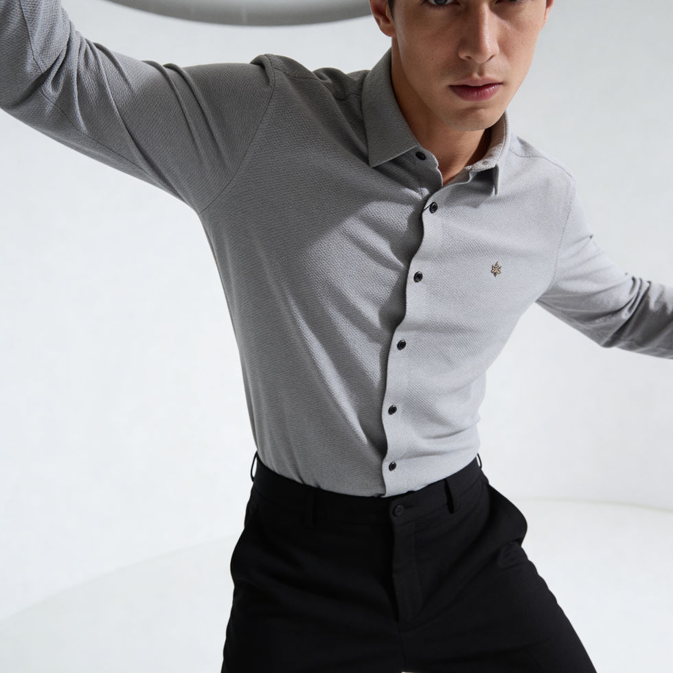 Model wearing a grey button-up shirt