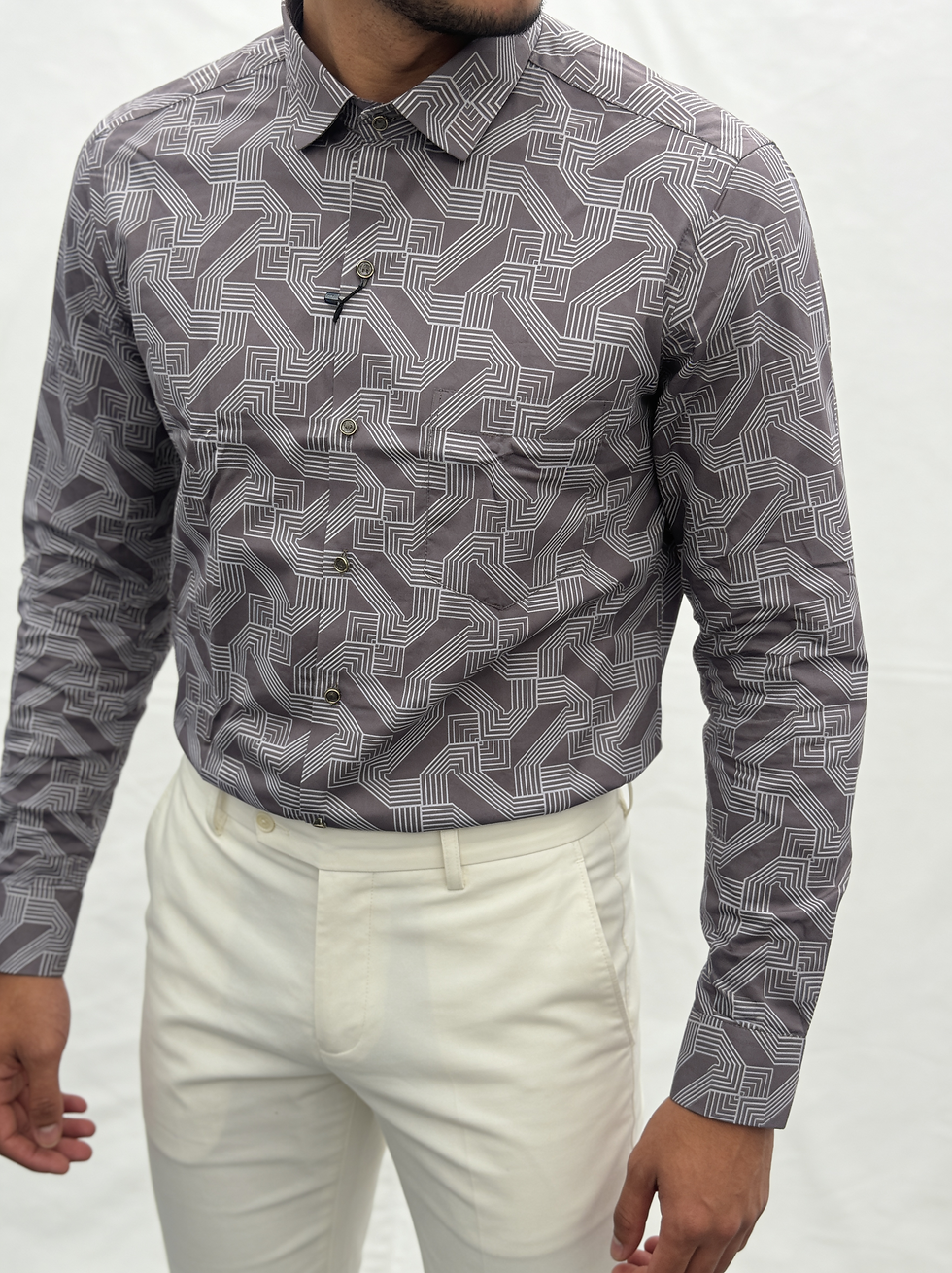 Man in grey geometric patterned shirt
