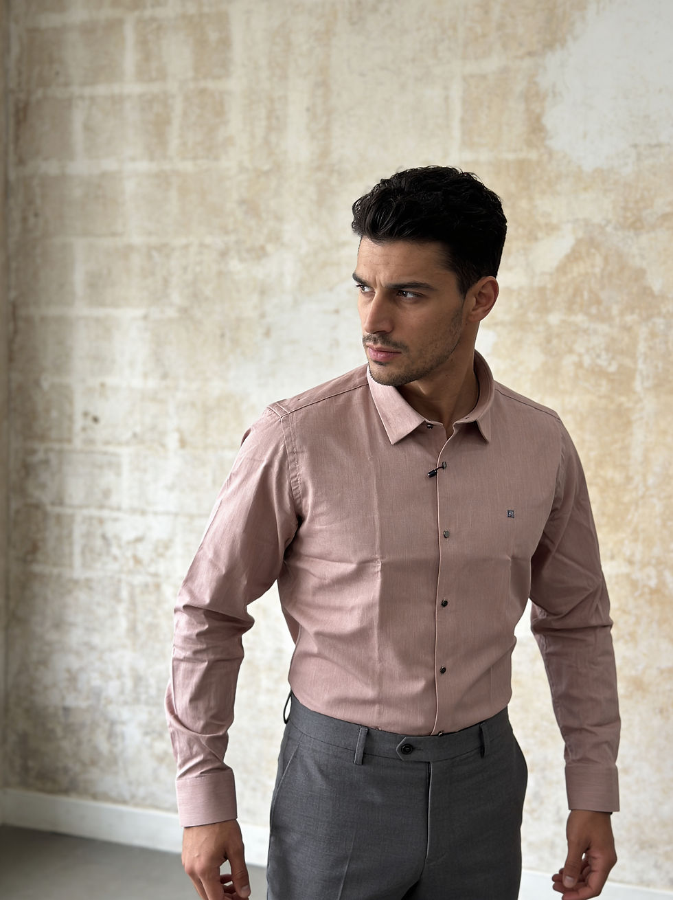 Man wearing a pink button-down shirt