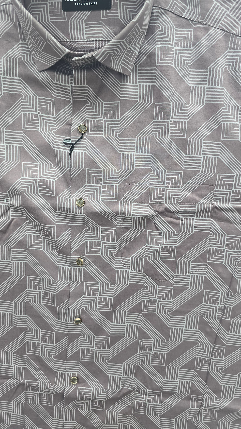 Grey shirt with geometric pattern and buttons