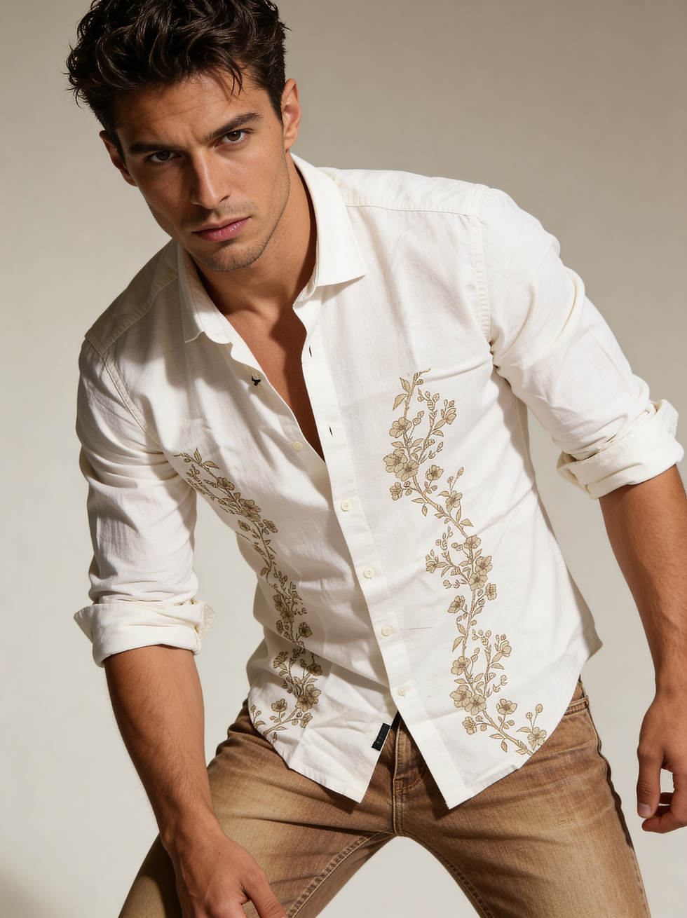 Man in white shirt with floral embroidery