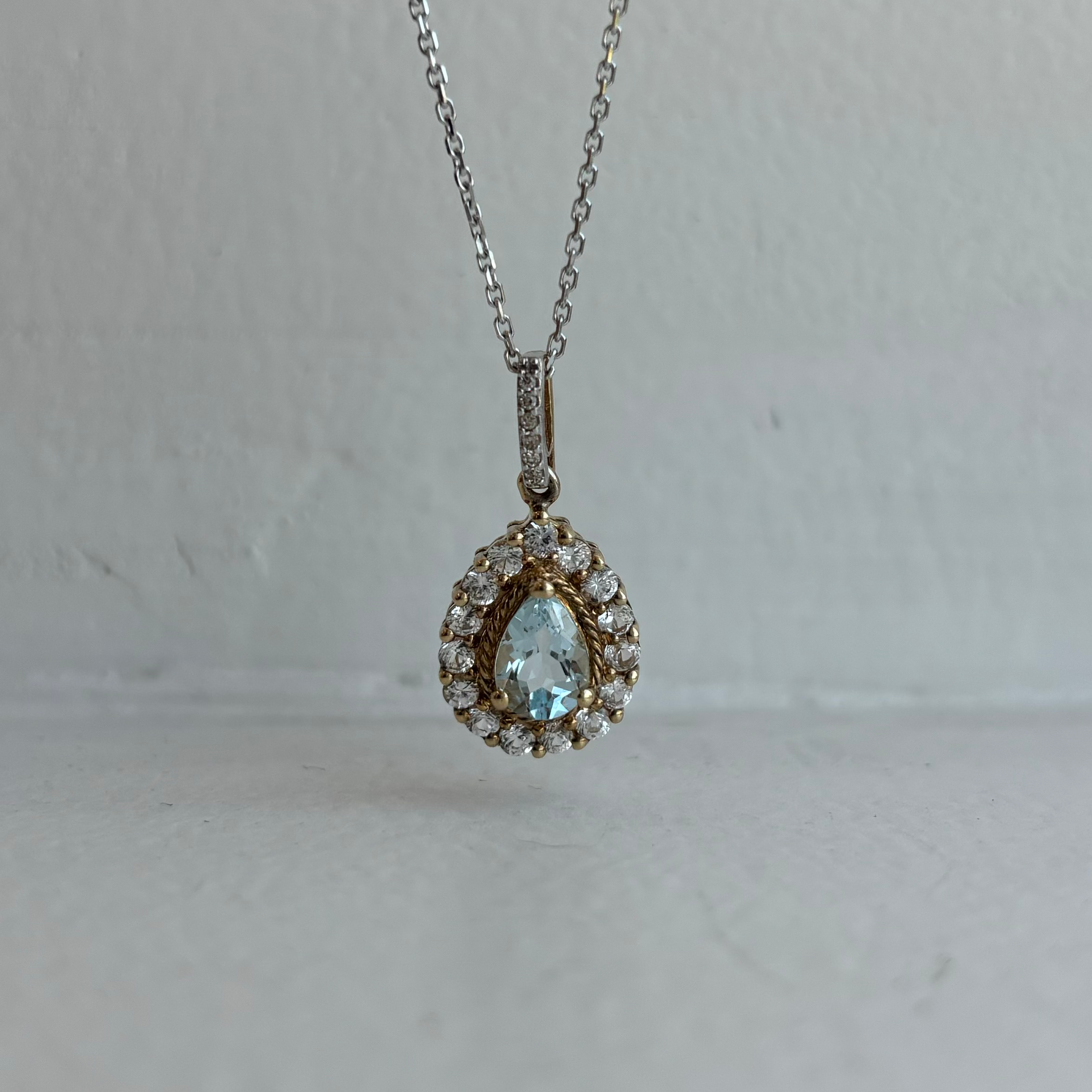 10K AQUAMARINE HALO PENDANT