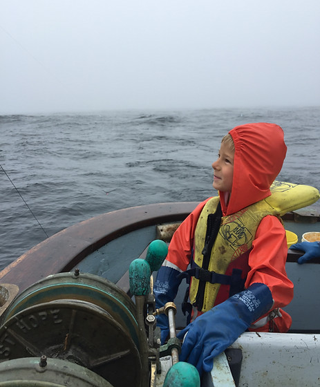 Kid running the gear, commercial salmon trolling.