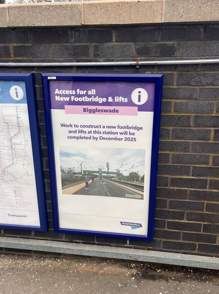 A poster at the station indicating a step-free Biggleswade station in December 2025.