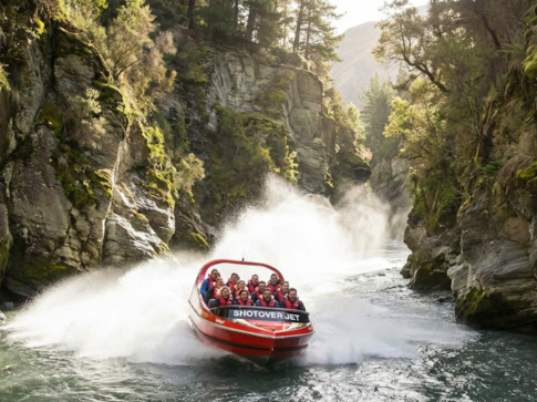 Eye-level shot, Shotover Jet boat speeding through a narrow canyon, Queenstown New Zealand, water spraying in the air, dynamic and exciting mood, landscape