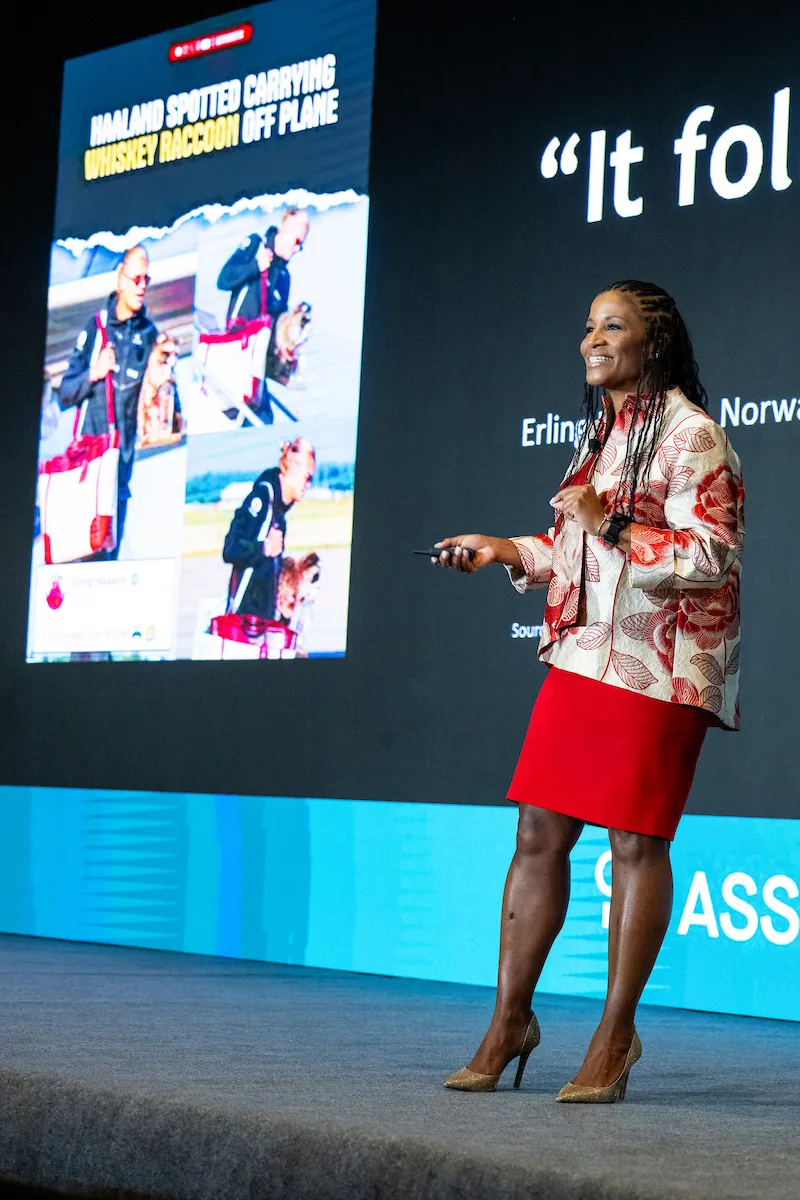 Noelle LeVeaux presenting on stage at the North American Marketing Leadership Summit